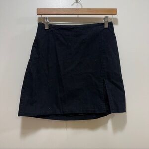 Black mini skirt with slit